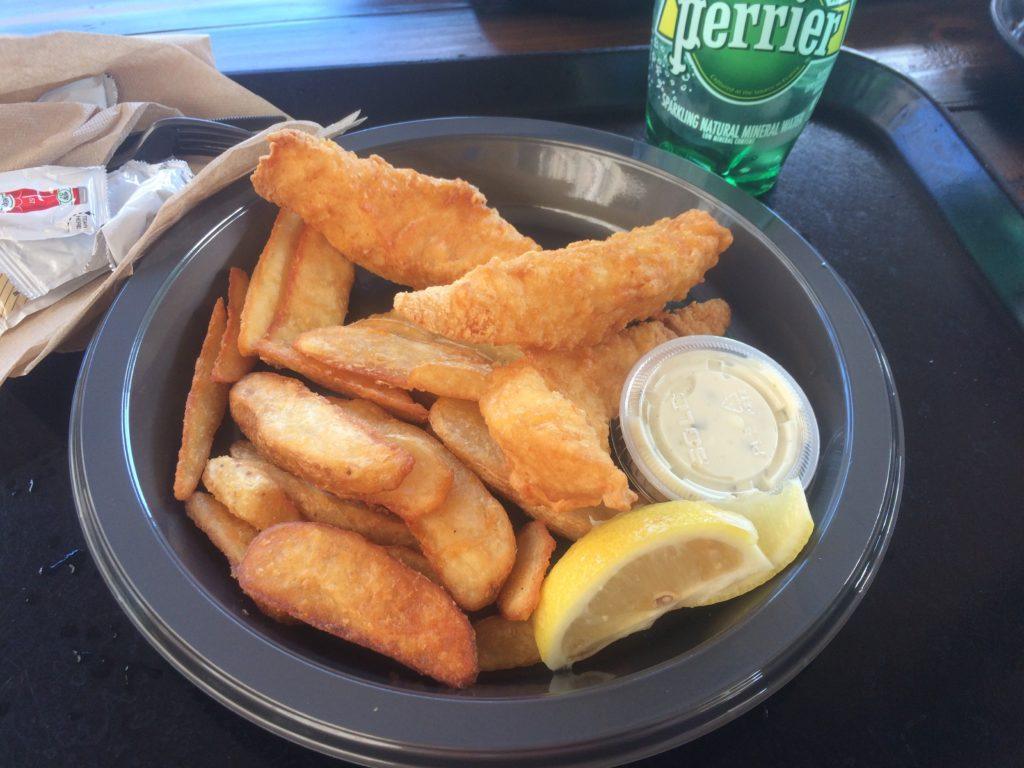Three Broomsticks fish and chips on a plastic plate at Universal Orlando